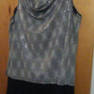 2 piece top and pleaded bottom.